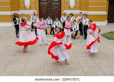 Musician Artists Dance And Sing To The Rhythm Of Guitars And Cajon In A Park. Group Africa 70 - Afro Music Of Peru. September 18, 2016, Lima, Peru