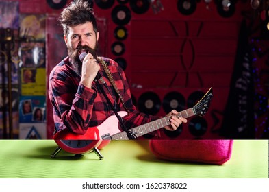 Musician With Beard Play Electric Guitar Instrument. Frontman Concept. Talented Musician, Soloist, Singer. Man With Shouting Face Play Guitar, Singing Song, Play Music, Music Club Background.