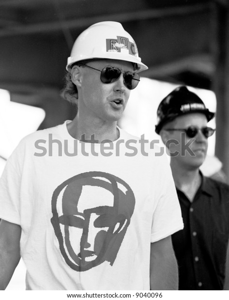 Musician Bruce\
Hornsby (foreground) and Curator James Henke (background) tour the\
Rock and Roll Hall of Fame and Museum of Cleveland, Ohio during its\
construction phase in\
1996.