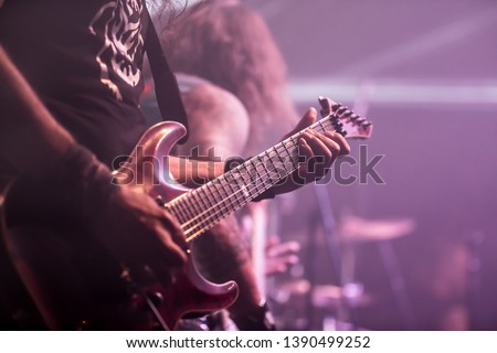Musician, guitarist playing electric guitar