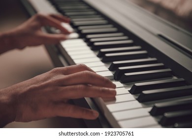 Musician Hands playing the piano closeup - Powered by Shutterstock