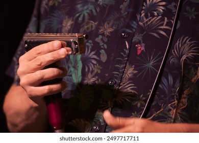 Musician holding a harmonica and microphone, wearing a floral patterned shirt during a live jazz performance. - Powered by Shutterstock