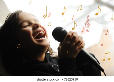 Musician Kid Singing A Song With Microphone