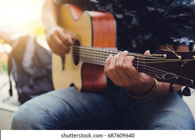 acoustic guitar player on stage