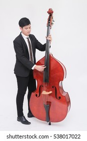 The Musician  Playing Double Bass Isolated On White Background (Artist / Young Performer)