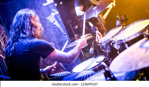 Musician Playing Drums On Stage