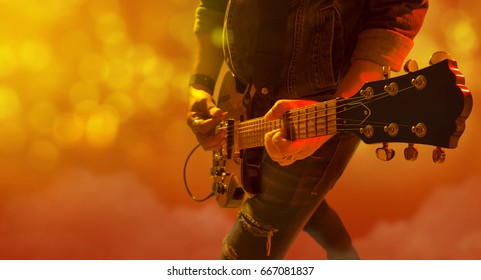 Musician Playing Electric Guitar On The Stage Concert