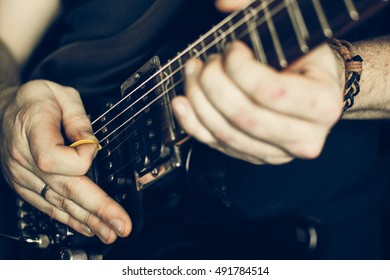 Musician Playing Electric Guitar Superstrat Type, Hands In Focus