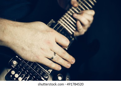 Musician Playing Electric Guitar Superstrat Type, Hands In Focus