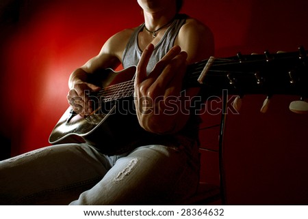 Similar – Young Boy Enjoying Music Playing Guitar Outdoors