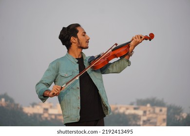 Musician Playing Violin. Music And Musical Tone Concept. Images Of Man Musician