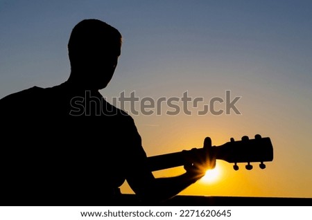 Musician silhouette with a guitar