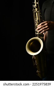 Musician's hands playing the saxophone - Shutterstock ID 2251975839