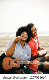 Musicians Having A Beach Picnic