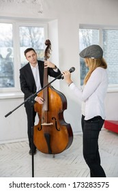 Musicians Look At Each Other While Warming Up