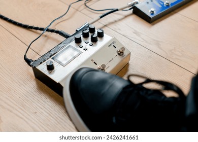 musician's male foot pressing bass drum pedal or bass electric guitar recording studio close-up - Powered by Shutterstock