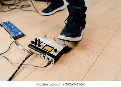 musician's male foot pressing bass drum pedal or bass electric guitar recording studio close-up - Powered by Shutterstock