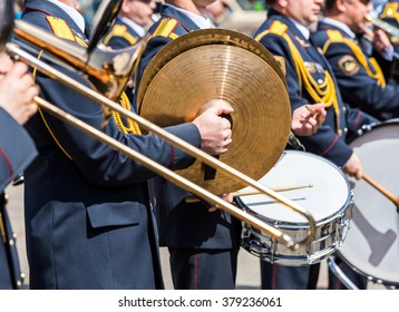 musicians of the military brass band plays the musical instruments - Powered by Shutterstock