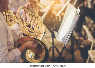 Musicians Playing French Horn Practice For Show In Music Band.