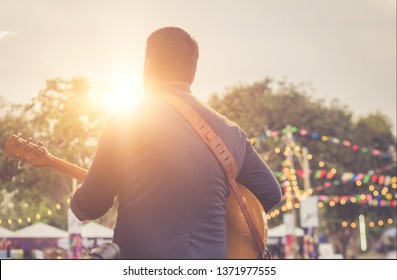 Musicians are playing guitar on stage. - Powered by Shutterstock