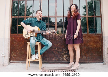 Musicians playing guitar and singing