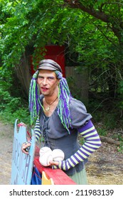 MUSKOGEE, OK - MAY 24: A Man Dressed As A Woman Calls People For A Game Of Dunk Tank At The Oklahoma 19th Annual Renaissance Festival On May 24, 2014 At The Castle Of Muskogee In Muskogee, OK 