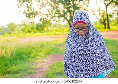 Muslim African Girl Praying Outside