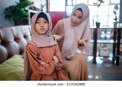 Muslim Angry Asian Mother Sitting With Little Daughter