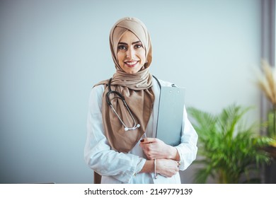 Muslim Arab person. The face of a female doctor on an isolated white background. The concept of Islamic health care in a technological research hospital. Nurse, nurse hijab nurse 
