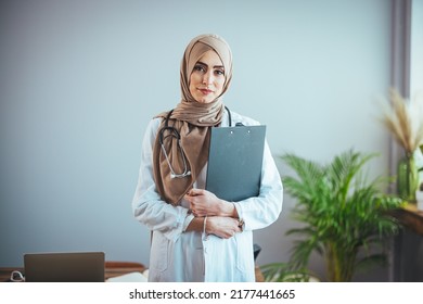 Muslim Arab person. The face of a female doctor on an isolated white background. The concept of Islamic health care in a technological research hospital. Nurse, nurse hijab nurse