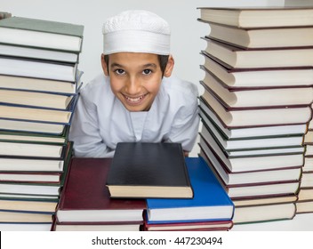 Muslim Arabic kid in library with books