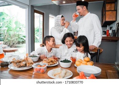 Muslim Asian Family Breaking The Fast Together Having Some Sweet Drink