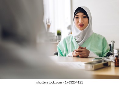 Muslim Asian Woman Doctor Service Help Support Discussing And Consulting Talk To Muslim Woman Patient And Check Up Information At Meeting Health Medical Care Express Trust Concept In Hospital