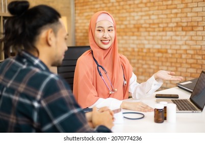 Muslim asian woman doctor service help support discussing and consulting talk to patient and check up information at meeting health medical care. - Powered by Shutterstock