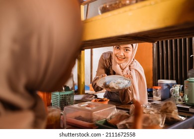 Muslim Asian Woman Preparing Her Food Stall