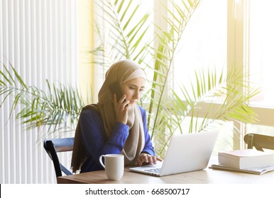 Muslim Asian Woman Working In Office With Laptop