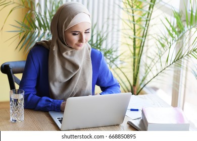 Muslim Asian Woman Working In Office With Laptop