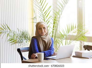 Muslim Asian Woman Working In Office With Laptop