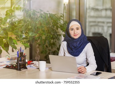 Muslim Asian Woman Working In Office With Laptop