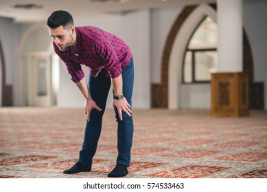 Muslim Bowing Down In Prayer