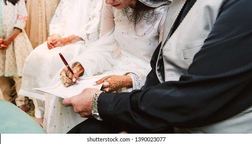 Muslim bridal signing her wedding certificate
Karachi, Pakistan, May 2019