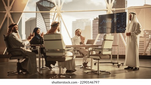 Muslim Businessman Holds Meeting Presentation for Diverse Business Partners. Managers Appreciate the Presentation, Celebrate Successful Year Over Year Results. Saudi, Emirati, Arab Office Concept