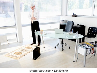 Muslim Businessman Praying At Office