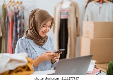 Muslim Businesswomen Using Mobile Phone Working