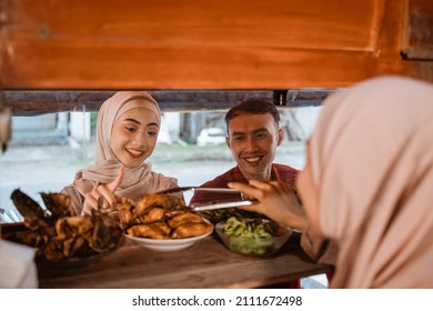 Muslim Couple Ordering Food To Break Fasting In Ramadan