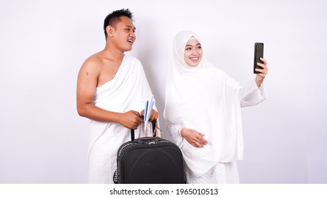 Muslim Couple Take A Selfie With Phone Isolated White Background