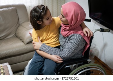 Muslim disabled young woman at home