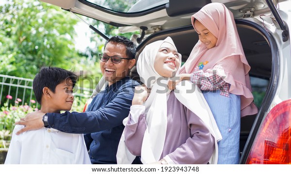 Muslim families travel back to their hometowns by car\
to celebrate Eid