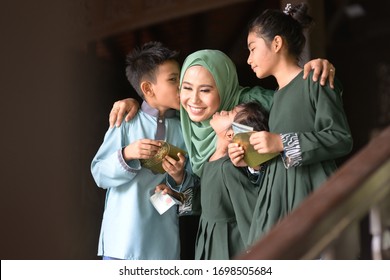 Muslim Family, Children Received Money Packet As Blessing, Hari Raya Eid Al-Fitr Concept. 