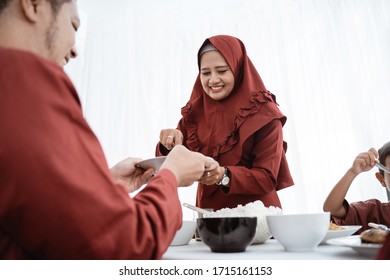 Muslim Family Enjoy Eating When Break Fasting Together At Home